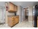 The kitchen features wooden cabinets, granite countertops, and access to a convenient side entrance and stainless steel refrigerator at 4390 Bimini Ct. # 206-C, Little River, SC 29566