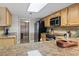 The kitchen features stainless steel appliances, granite countertops, and seamless transition into the living area at 4390 Bimini Ct. # 206-C, Little River, SC 29566