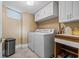 Laundry room featuring a washer, dryer, utility sink and extra storage space at 4390 Bimini Ct. # 206-C, Little River, SC 29566