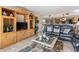 Comfortable living room with a plush sofa and large entertainment center at 4390 Bimini Ct. # 206-C, Little River, SC 29566
