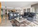 Living room with tile flooring, sofa, and a view of the kitchen and dining area at 4390 Bimini Ct. # 206-C, Little River, SC 29566