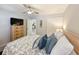 Main bedroom with dresser, doors to the bathroom and large bed at 478 Pinehurst Ln. # 17F, Pawleys Island, SC 29585
