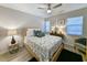 Cozy bedroom with a wooden bed frame and ample natural light at 478 Pinehurst Ln. # 17F, Pawleys Island, SC 29585