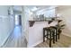 Modern kitchen with breakfast bar and stainless steel appliances at 478 Pinehurst Ln. # 17F, Pawleys Island, SC 29585