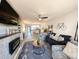 Open living room with fireplace and a view into the dining area at 478 Pinehurst Ln. # 17F, Pawleys Island, SC 29585