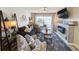 Comfortable living room with fireplace and access to balcony at 478 Pinehurst Ln. # 17F, Pawleys Island, SC 29585