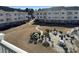 Ground level view of condo courtyard with patio tables and grills at 4860 Carnation Circle # 304, Myrtle Beach, SC 29579