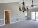 Dining room with carpet, chandelier and access to balcony at 4860 Carnation Circle # 304, Myrtle Beach, SC 29579