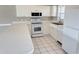 White kitchen with appliances, ample counter space and cabinets at 4860 Carnation Circle # 304, Myrtle Beach, SC 29579