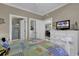 Bedroom with white dresser, TV, and view into other rooms at 4894 Luster Leaf Circle # 304, Myrtle Beach, SC 29577