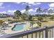 Community pool with lounge chairs at 4894 Luster Leaf Circle # 304, Myrtle Beach, SC 29577