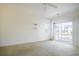 Bright bedroom with a ceiling fan and sliding glass doors to a balcony at 5011 Harvest Dr. # 101, Myrtle Beach, SC 29579