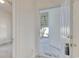 Bright entryway featuring a covered porch, leading into a neutral toned interior of this property at 5011 Harvest Dr. # 101, Myrtle Beach, SC 29579
