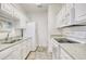 This kitchen features white cabinetry, modern appliances, and granite countertops at 5011 Harvest Dr. # 101, Myrtle Beach, SC 29579