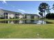 Scenic view of a pond and surrounding lawns at 5011 Harvest Dr. # 101, Myrtle Beach, SC 29579