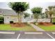 Exterior view of a community pool and lush landscaping at 5011 Harvest Dr. # 101, Myrtle Beach, SC 29579