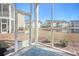 Relaxing screened porch overlooking a serene pond and lush landscaping at 5011 Harvest Dr. # 101, Myrtle Beach, SC 29579