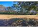 Spacious backyard with mature trees and grassy area at 534 Juniper Dr. # 534, Myrtle Beach, SC 29577