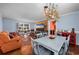 Dining room features a light gray table and unique chandelier at 534 Juniper Dr. # 534, Myrtle Beach, SC 29577
