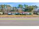 Front view of charming brick ranch houses with green accents at 534 Juniper Dr. # 534, Myrtle Beach, SC 29577