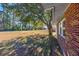 Side yard with mature trees and grassy area at 534 Juniper Dr. # 534, Myrtle Beach, SC 29577