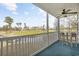 Balcony with small table and chairs overlooking the golf course at 565 White River Dr. # 10-E, Myrtle Beach, SC 29579