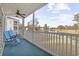 Balcony with patio furniture and golf course views at 565 White River Dr. # 10-E, Myrtle Beach, SC 29579
