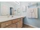 Bathroom with light blue walls, a vanity with a sink, and a mirror at 565 White River Dr. # 10-E, Myrtle Beach, SC 29579