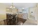 Bright dining area with a table and four chairs, adjacent to kitchen at 565 White River Dr. # 10-E, Myrtle Beach, SC 29579
