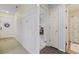 A hallway with light colored walls, wood flooring, and access to other rooms at 565 White River Dr. # 10-E, Myrtle Beach, SC 29579