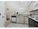 Kitchen with granite countertops, light wood cabinets, and a dishwasher at 565 White River Dr. # 10-E, Myrtle Beach, SC 29579