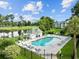 Resort-style pool with plenty of lounge chairs at 565 White River Dr. # 10-E, Myrtle Beach, SC 29579