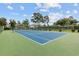Community tennis court with green surrounding at 565 White River Dr. # 10-E, Myrtle Beach, SC 29579