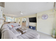 Open living space with sectional sofa and views into kitchen and dining area at 565 White River Dr. # 10-E, Myrtle Beach, SC 29579