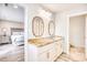 Double vanity bathroom with granite countertop and access to bedroom at 5816 Woodside Ave., Myrtle Beach, SC 29577