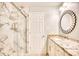 Spa-like bathroom with marble shower and granite vanity at 5816 Woodside Ave., Myrtle Beach, SC 29577