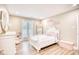 Charming bedroom with white furniture and decorative accents at 5816 Woodside Ave., Myrtle Beach, SC 29577