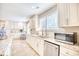 Bright kitchen features granite counters and white cabinetry at 5816 Woodside Ave., Myrtle Beach, SC 29577
