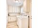 Bright laundry room with washer, dryer, and built-in cabinets at 5816 Woodside Ave., Myrtle Beach, SC 29577