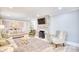 Living room with stone fireplace, neutral decor, and ample natural light at 5816 Woodside Ave., Myrtle Beach, SC 29577