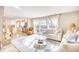 Bright living room features a fireplace and opens to kitchen at 5816 Woodside Ave., Myrtle Beach, SC 29577