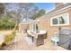 Brick patio with seating area and grill, perfect for outdoor entertaining at 5816 Woodside Ave., Myrtle Beach, SC 29577