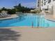 Relaxing resort-style pool with ample lounge chairs at 5905 S Kings Hwy. # 217-C, Myrtle Beach, SC 29575