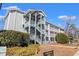 Building exterior showcasing balconies and landscaping at 5905 S Kings Hwy. # 4103, Myrtle Beach, SC 29575