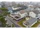 Aerial view of a coastal neighborhood featuring homes on stilts with decks, capturing a relaxed beachside lifestyle at 6001- P04 S Kings Highway, Myrtle Beach, SC 29575