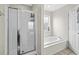 Well-maintained bathroom showcasing a shower, soaking tub, and a window for natural light at 6001- P04 S Kings Highway, Myrtle Beach, SC 29575