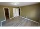 Spacious bedroom with double doors leading to a bathroom and closet at 615 Carter Ln. # B4, Conway, SC 29526