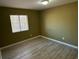 Bright bedroom featuring light walls and wood-look flooring at 615 Carter Ln. # B4, Conway, SC 29526