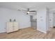Dining area with hardwood floor, ceiling fan and view to kitchen at 7700 Porcher Dr. # 4202, Myrtle Beach, SC 29572