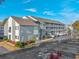 Two-story building with ample parking and landscaping at 7700 Porcher Dr. # 4202, Myrtle Beach, SC 29572